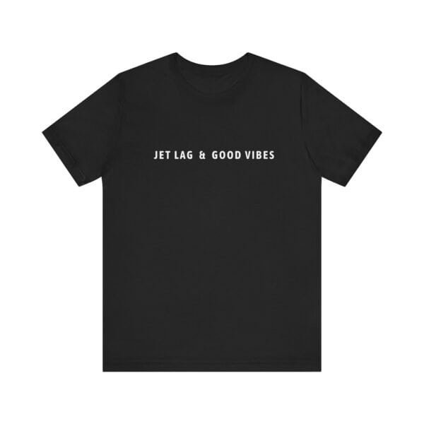 Black jetsetter tee with white minimalist text “Jet Lag & Good Vibes” printed on the front.