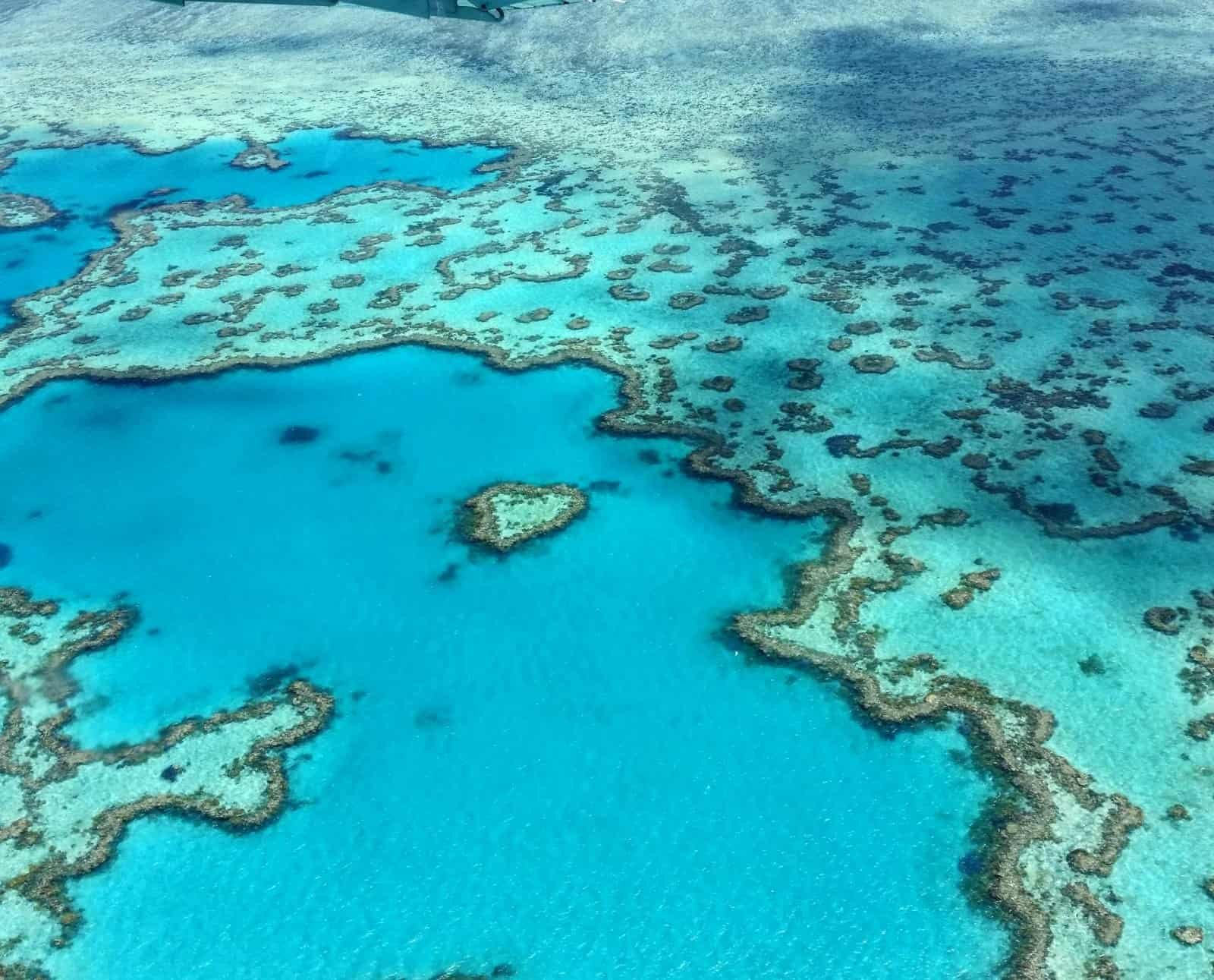Stunning aerial photograph of the heart-shaped Great Barrier Reef in the Whitsundays, Australia. Natural Wonders